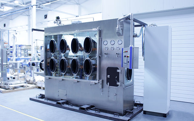 Close-up of glove ports on a DEC containment isolator installation