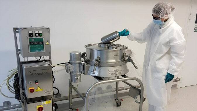 Compact Sieve installed in pharmaceutical cleanroom with operator